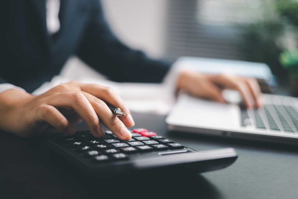 financial-clarity-new professional using computer and calculator