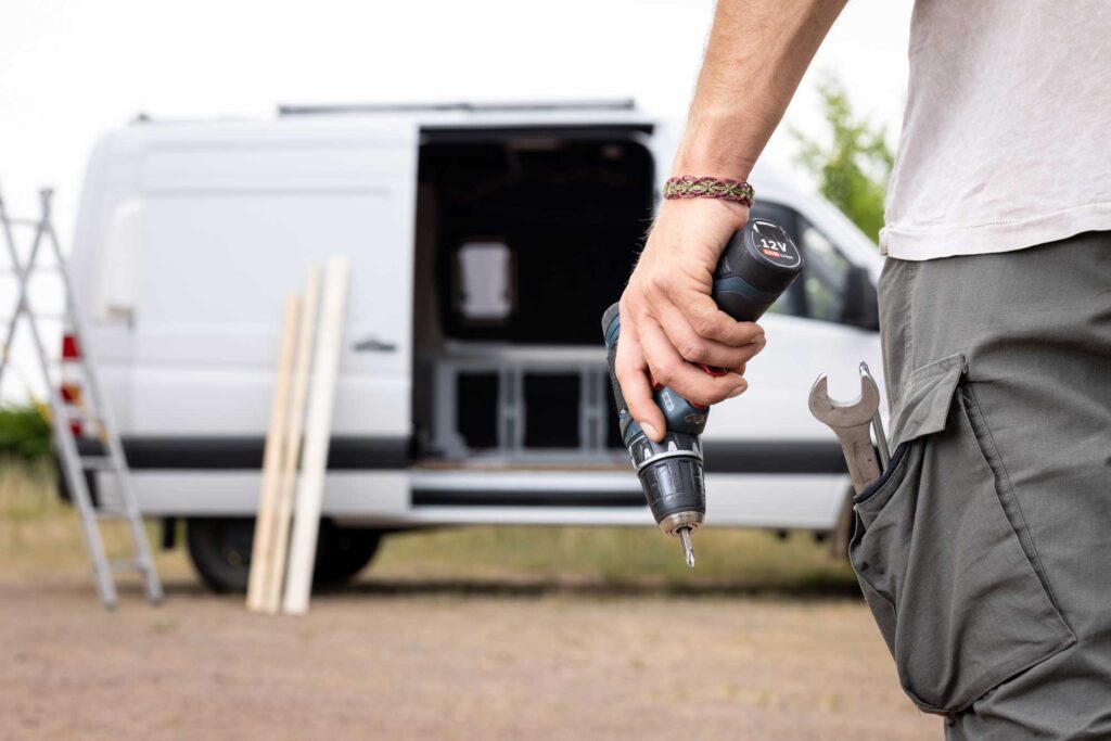 maintenance-repairs contractor holds tools on site