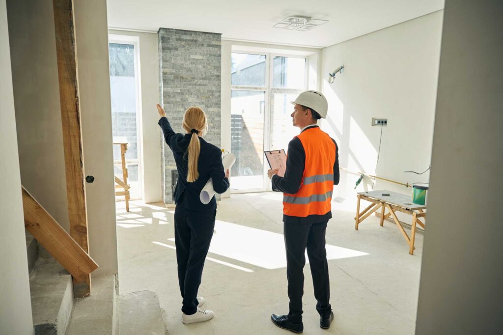 risk-mitigation two professionals examining construction site